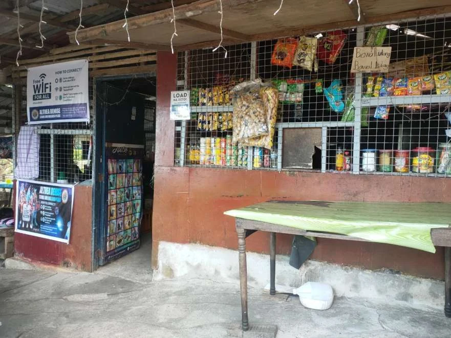 Free public WiFi installation at a rural Philippine sari-sari store sponsored by Jilibet JILI Play community program with connectivity instructions visible